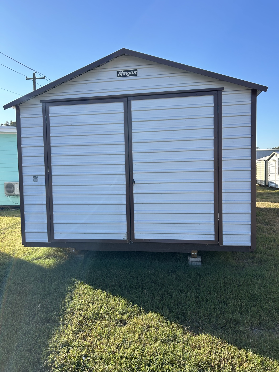 Morgan Buildings storage building on the Alvin lot